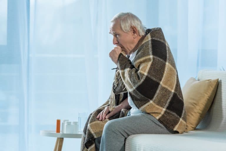 Senior man coughing