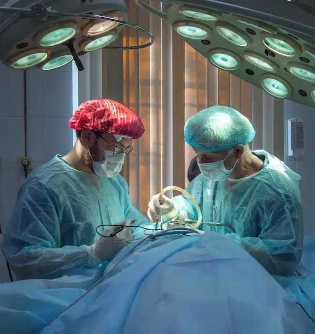 Surgeon operating on empyema